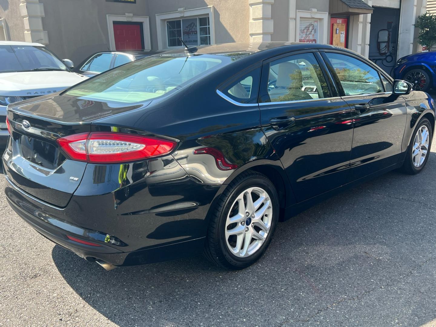 2016 BLACK /Beige Ford Fusion (3FA6P0H78GR) , located at 1018 Brunswick Ave, Trenton, NJ, 08638, (609) 989-0900, 40.240086, -74.748085 - Photo#2